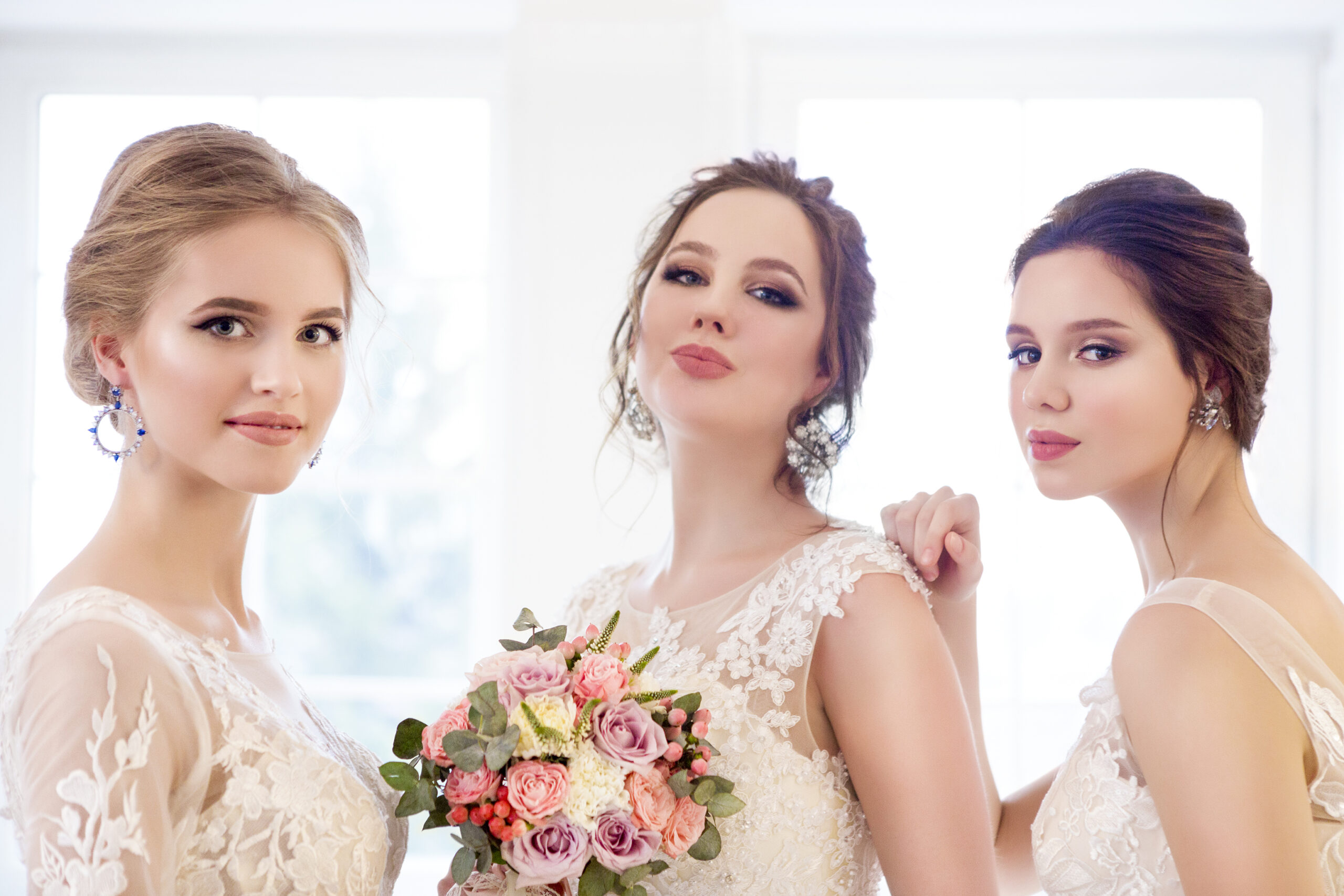 young-woman-with-bouquets-wearing-wedding-dresses