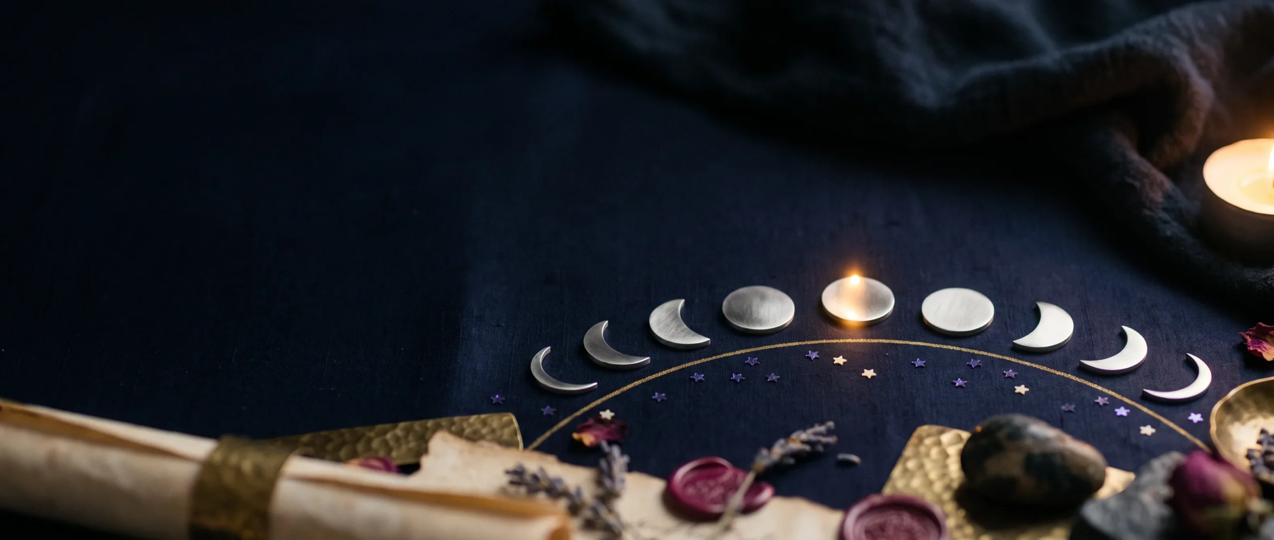 The eight moon phases as silver discs in an arc across a midnight-blue field, joined by a faint gold line.