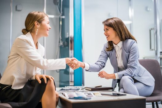 businesswomen make a deal
